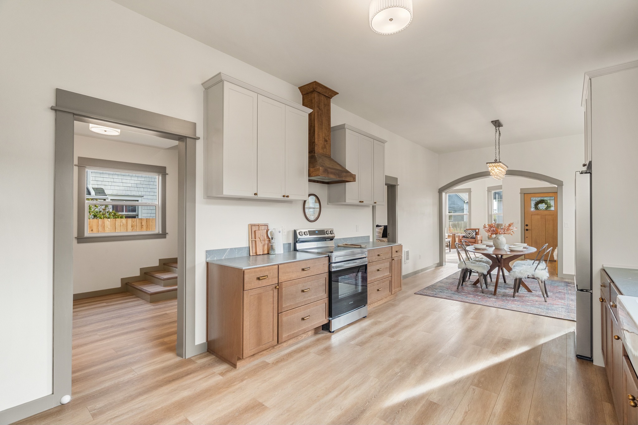 Eklund Ave — galley kitchen with oak cabinets and farmhouse sink