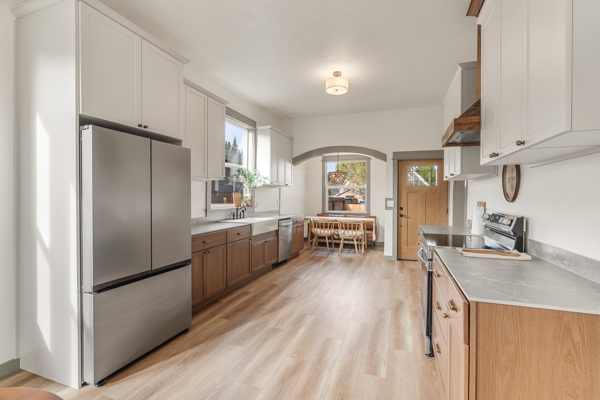 Eklund Ave — kitchen with stainless appliances and apron sink