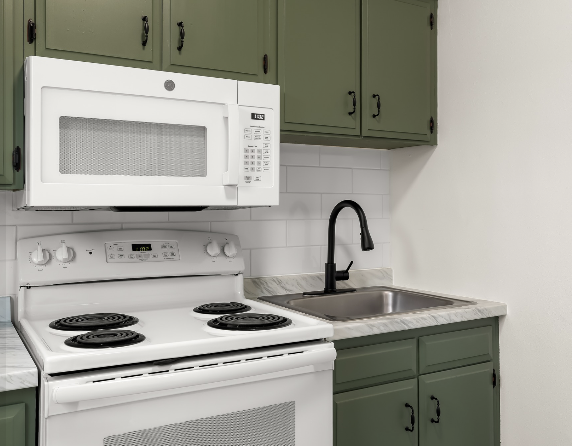 Mayflower Apartments — kitchen detail with matte black faucet