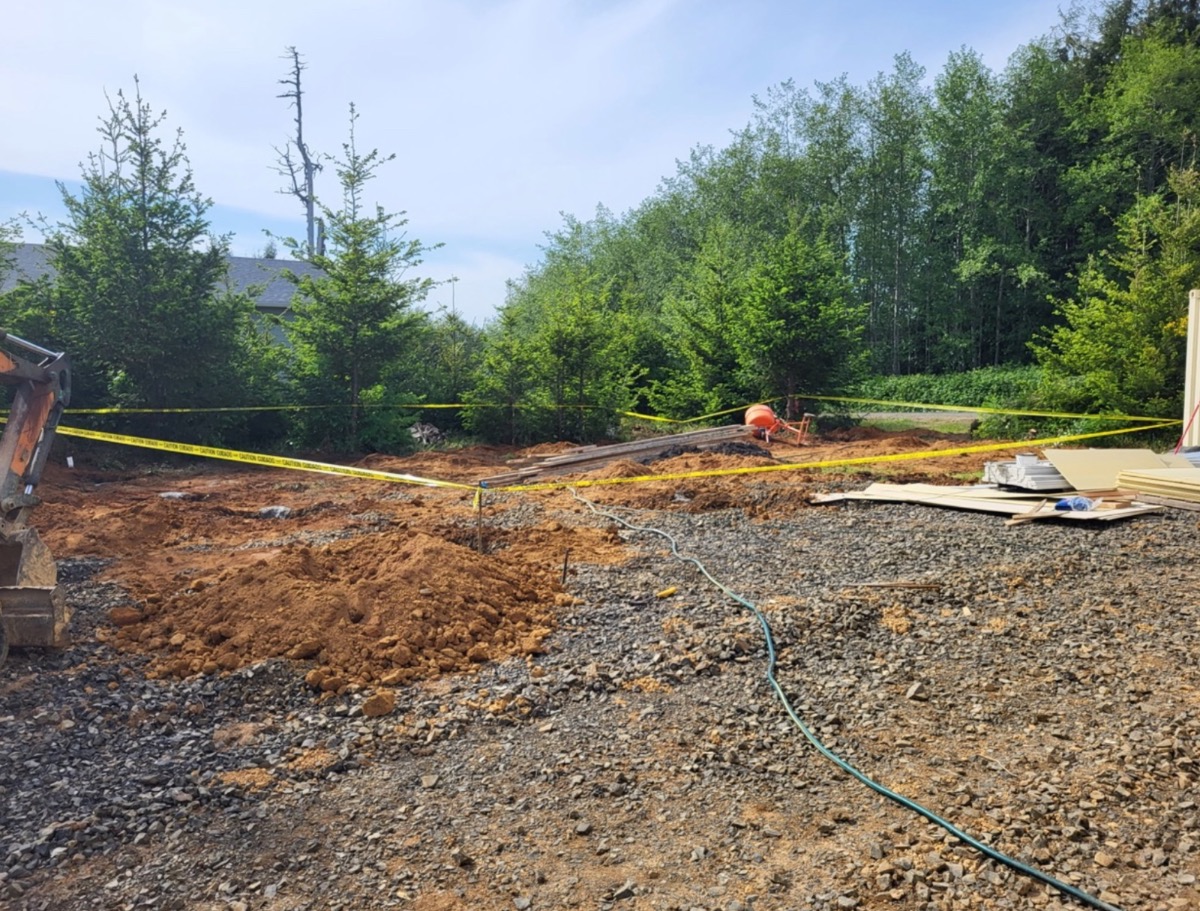Site prep — lot cleared and staked