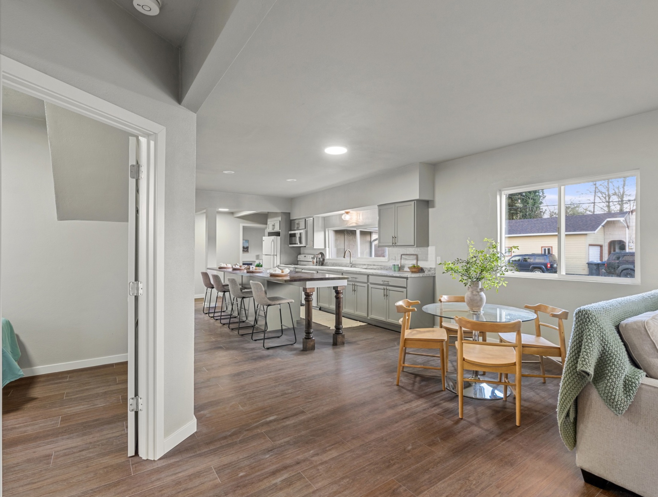 S W Blvd — open kitchen and dining with gray cabinetry