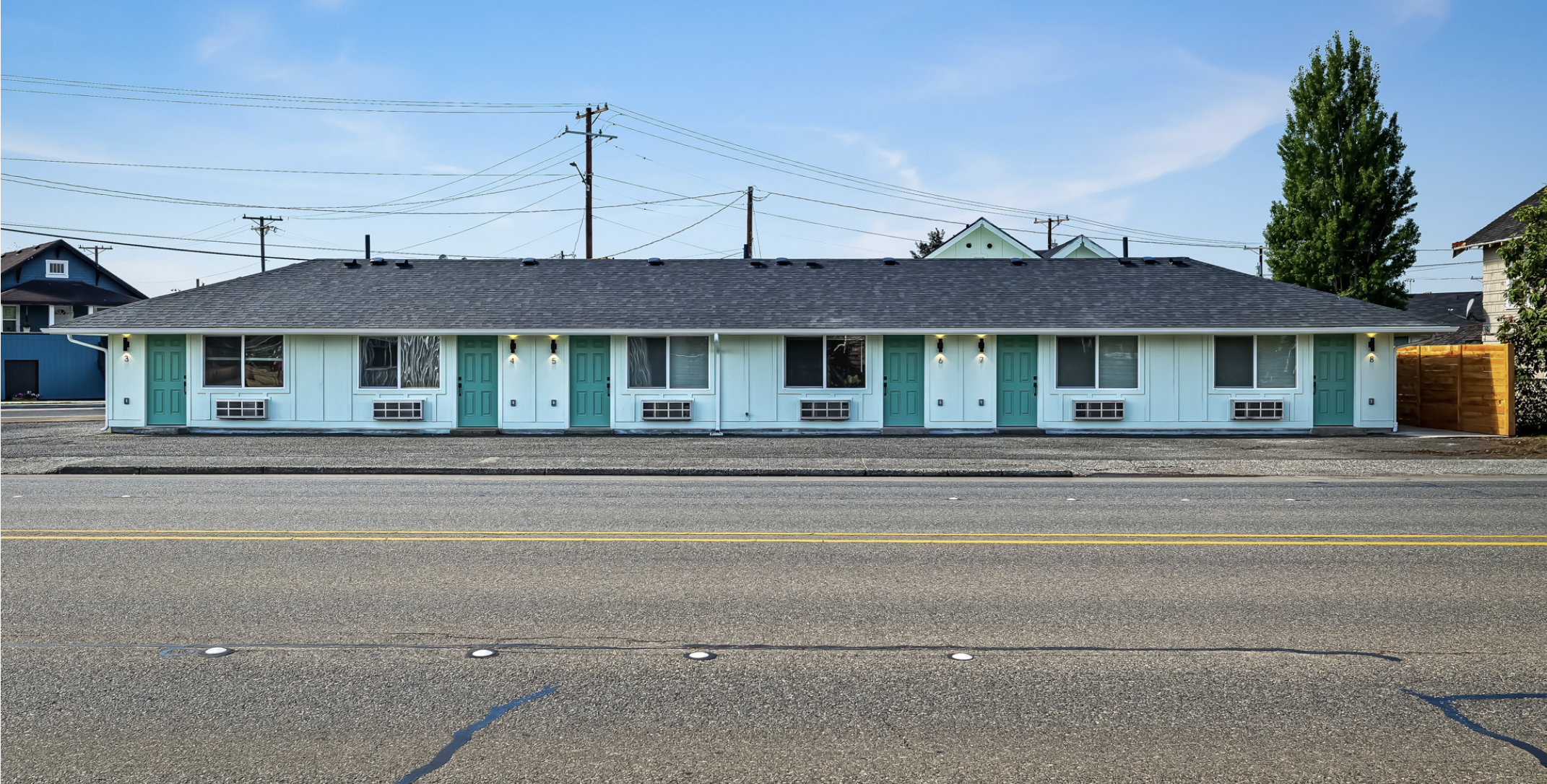 S West Blvd Apartments — 8-unit single-story with teal doors