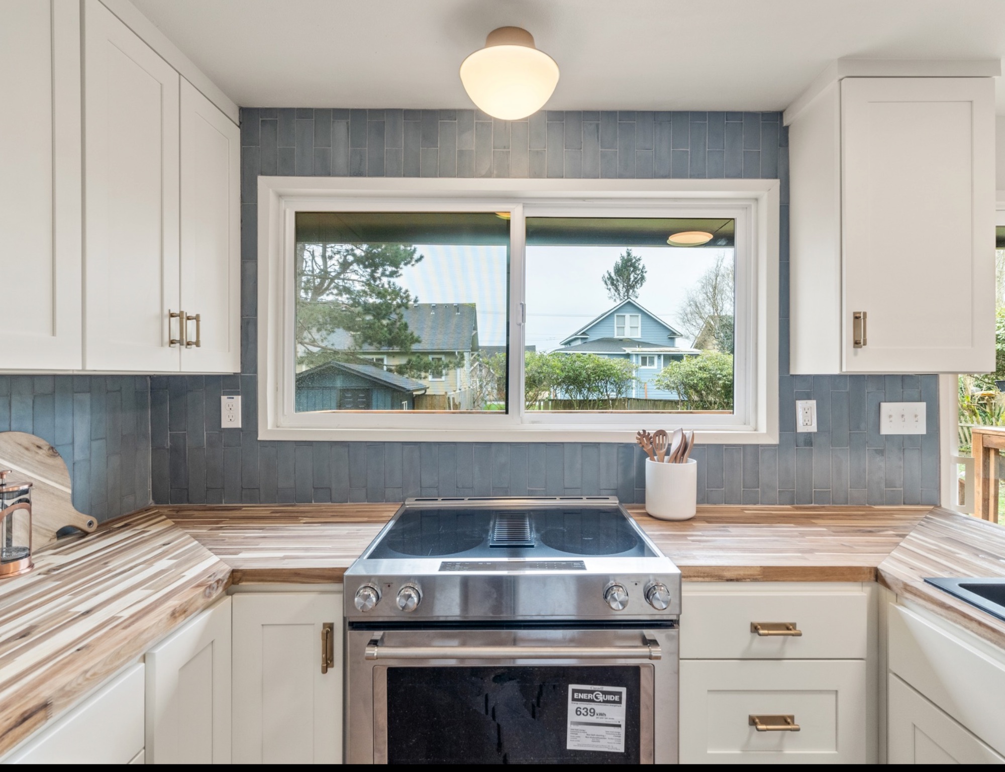 W 5th — kitchen with blue tile backsplash