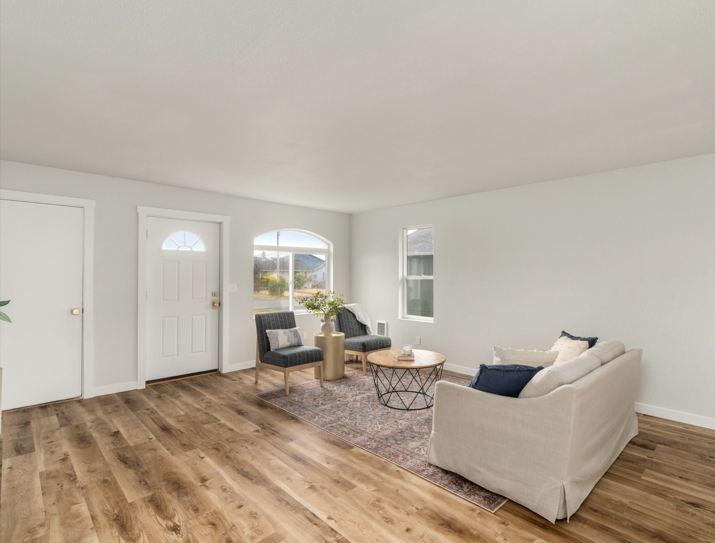 Market St — living room with arched window and seating