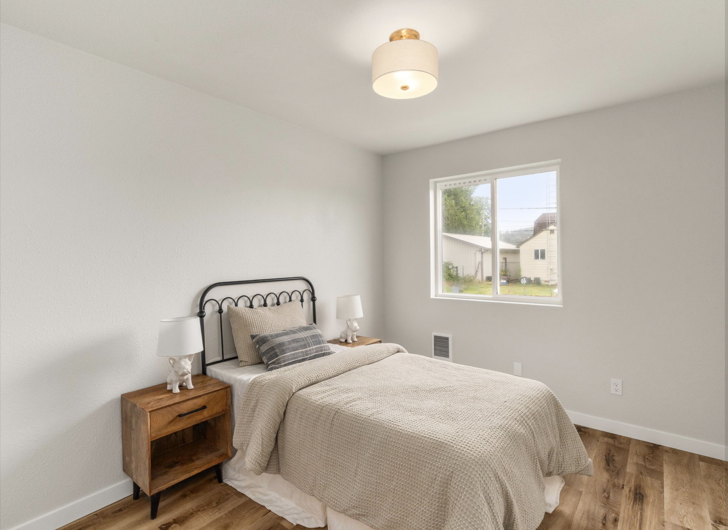 Market St — guest bedroom with iron bed frame