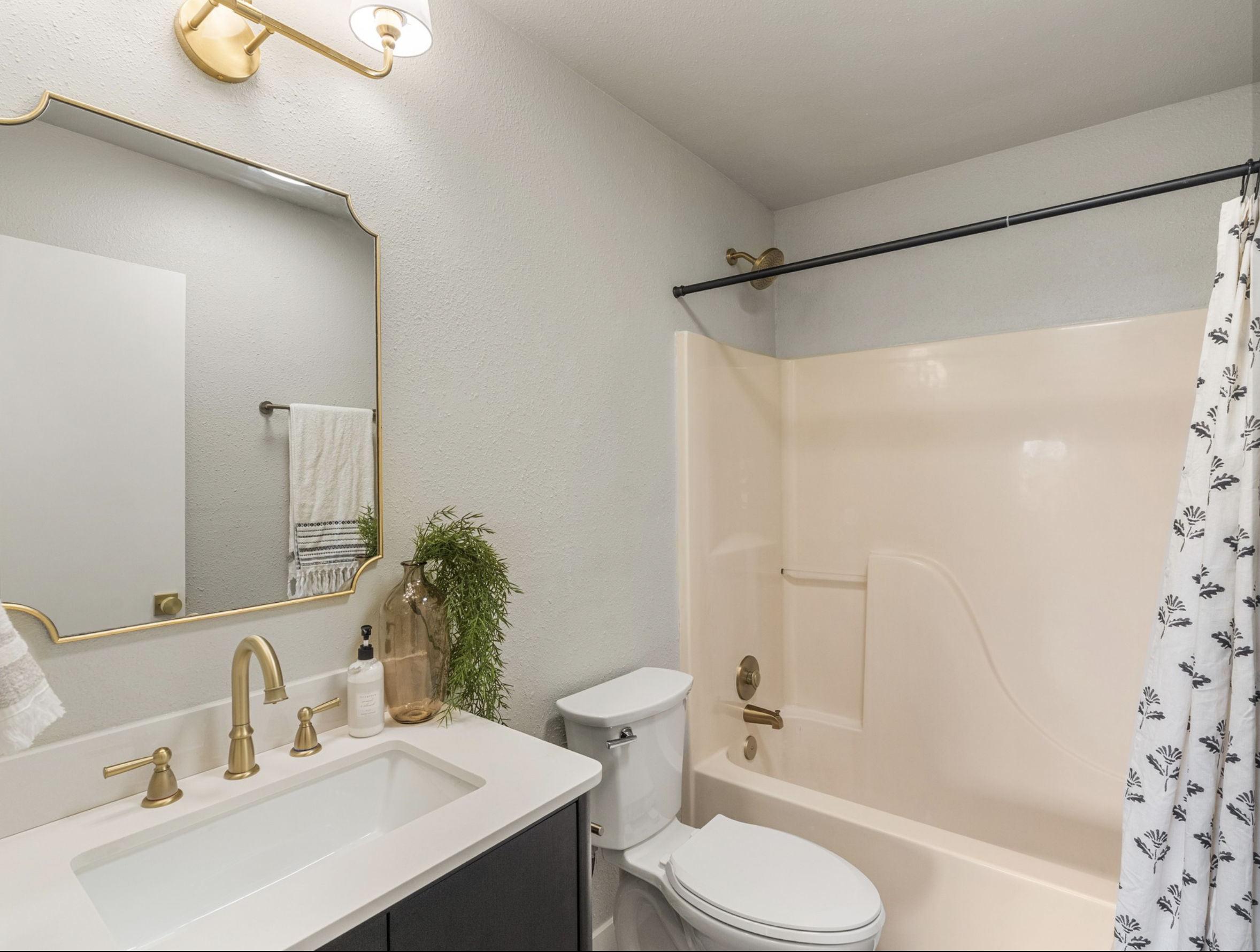 W Market St — guest bath with brass fixtures